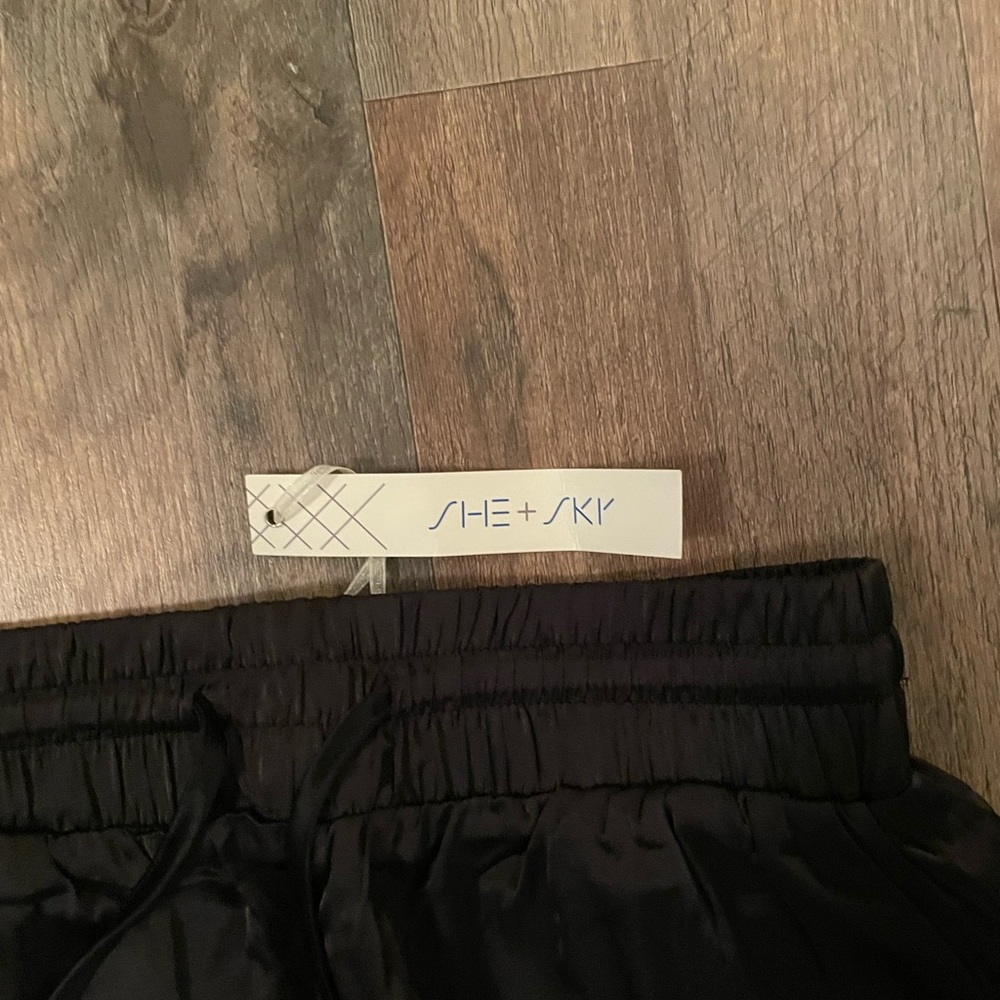 Black satin joggers. Dress them up or down. Never worn